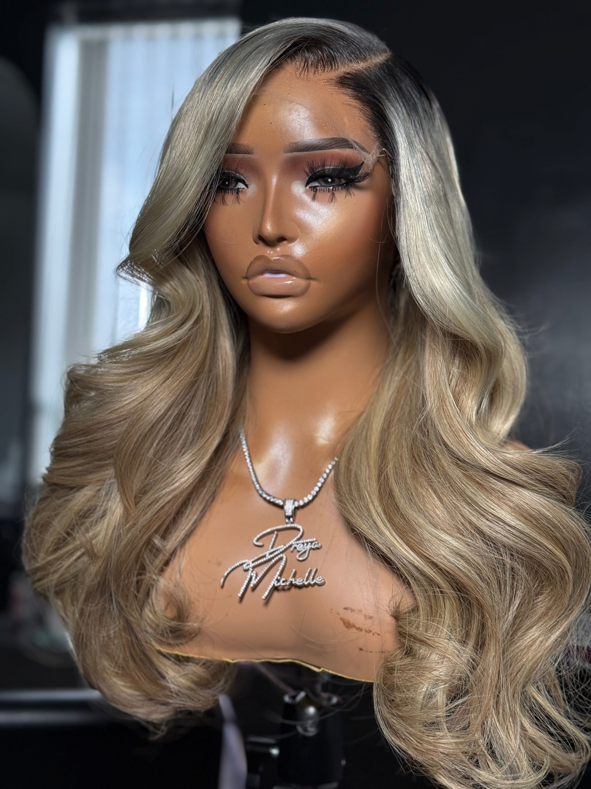 Side view of a Custom Blonde Glueless wig with soft curls and layes